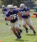 Football Practice Report – Day Two The Irish defense works through some pursuit drills during a hot practice on Tuesday, Aug. 9.