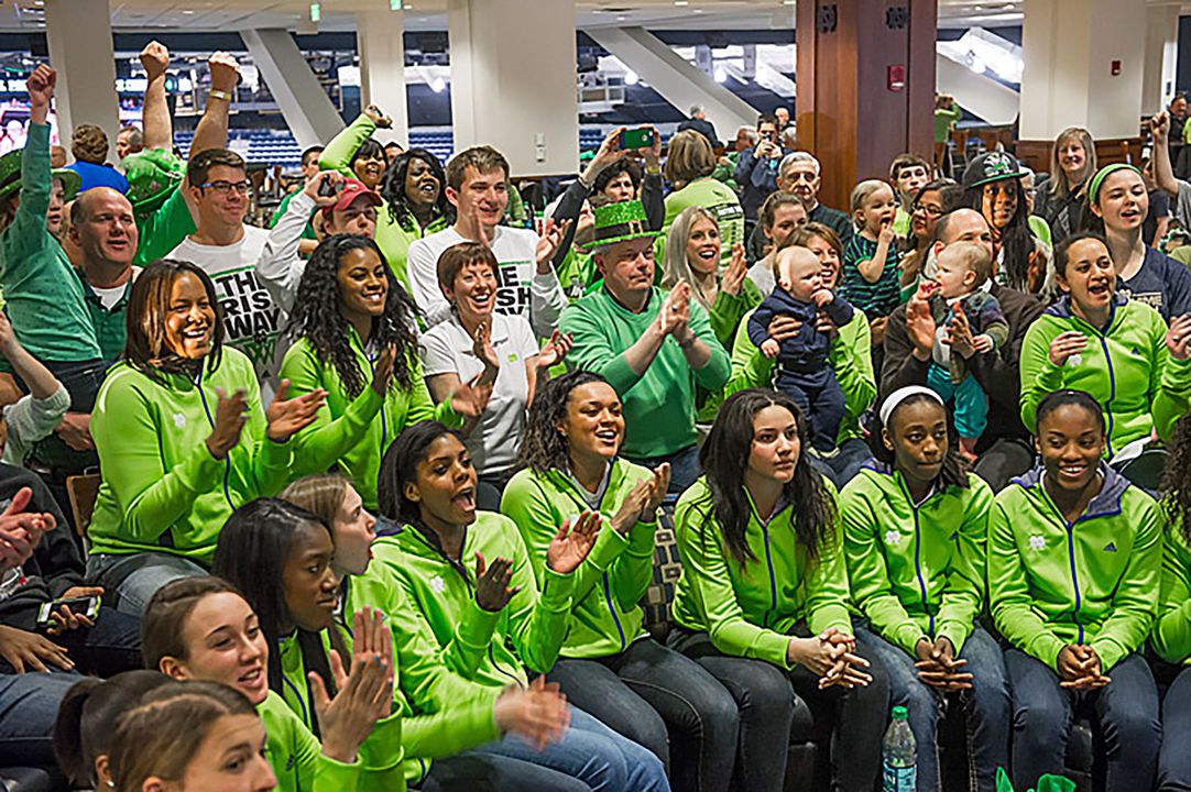 Notre Dame head coach Muffet McGraw (center, white shirt) and the Fighting Irish celebrate their selection as a No. 1 seed in the 2014 NCAA Championship. Notre Dame will open tournament play at 1:30 p.m. (ET) Saturday against Robert Morris in Toledo, Ohio.
