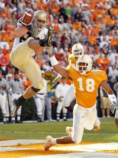 Anthony Fasano juggles, but makes a touchdown catch against Tennessee last weekend.