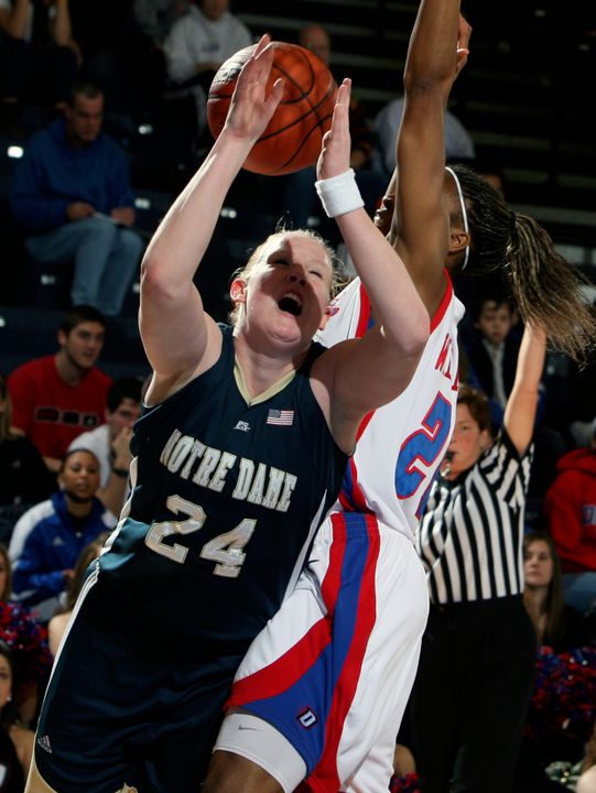 Lindsay Schrader is fouled by DePaul forward Natasha Williams during the first half. (AP Photo/Joseph Oliver)