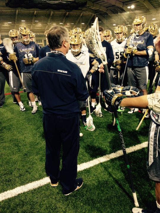 Head coach Kevin Corrigan addresses the team during Sunday's first practice session.