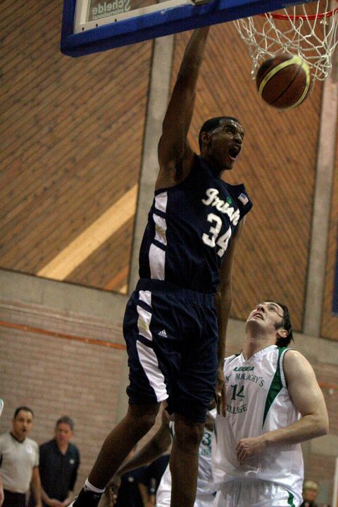 Sophomore forward Carleton Scott turned in a second consecutive strong outing on the Ireland tour, tallying 15 points (including this monster dunk) and five rebounds in Notre Dame's 123-77 win over the Irish All-Stars on Sunday in Belfast. <i>(photo by Tish Brey)</i>