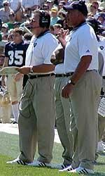 Notre Dame assistant coaches Kent Baer and Greg Mattison on the sideline of a game during the 2002 season (File Photo)