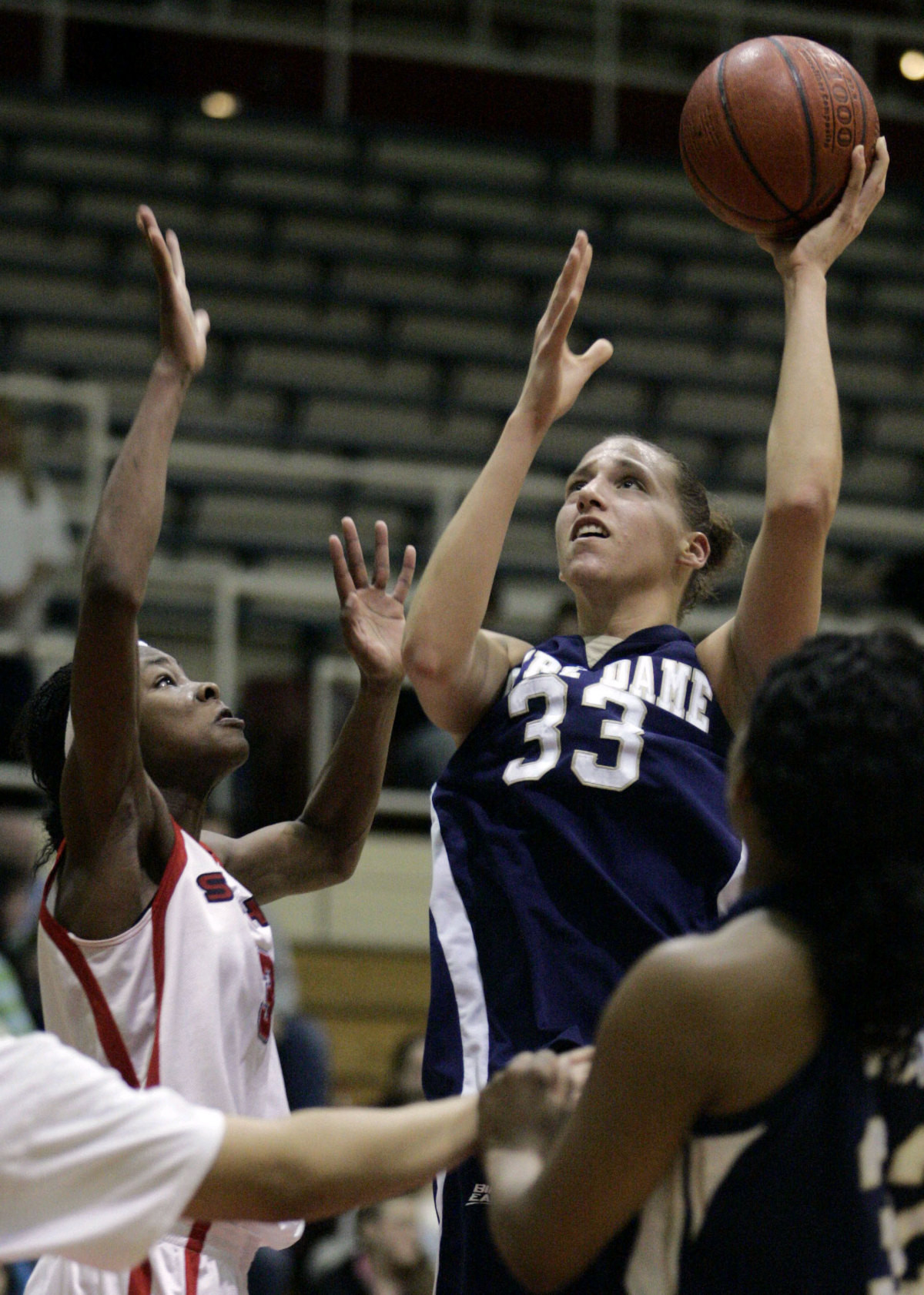 Irish Drop Big East Opener At St. John’s Melissa D'Amico shoots past St. John's Angela Clark during the first half.