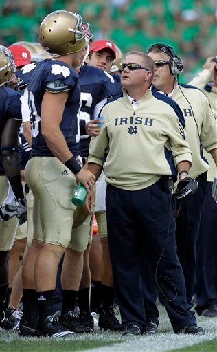 Brian Kelly and Dayne Crist talk during the Notre Dame - Purdue game on Sept. 4.