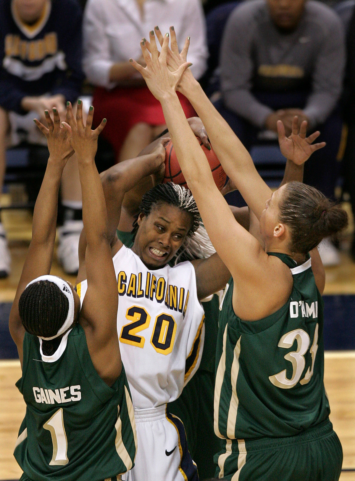Irish Take Down Cal 62-59 in NCAA Opening Round Tulyah Gaines and Erica Williamson defend California's Devanei Hampton in the second half. (AP Photo/Keith Srakocic)