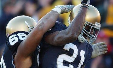 No. 6 Notre Dame Cruises Past Syracuse, 34-10 Maurice Stovall reacts with Ryan Harris after a 25-yard touchdown reception during the second quarter.