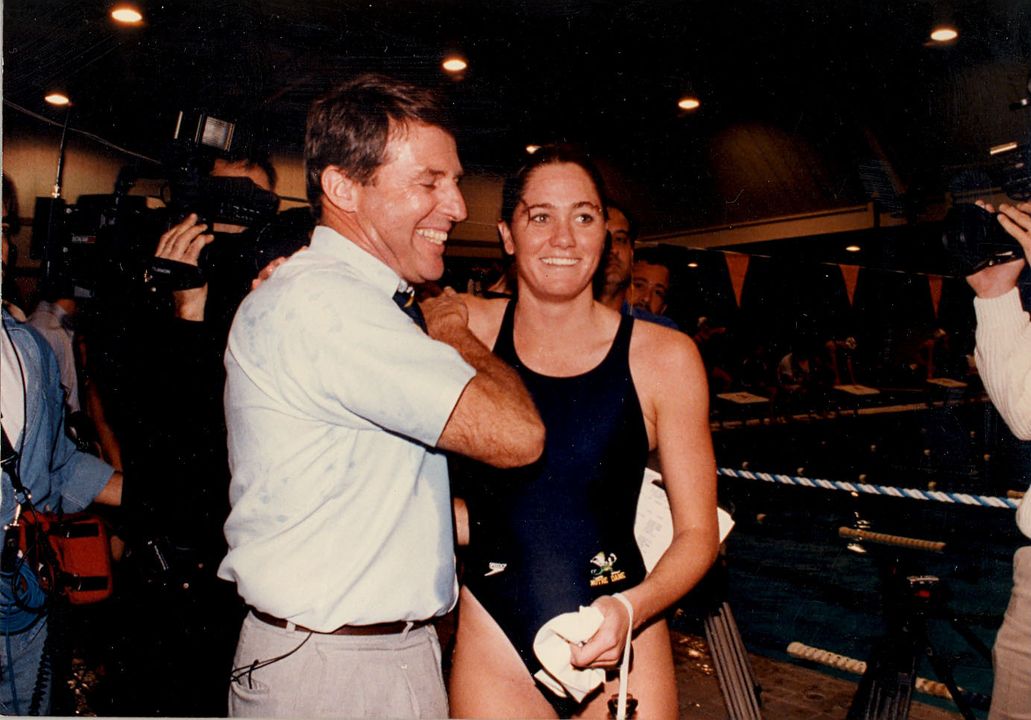 Scott DeMaria celebrates with head coach Tim Welsh (left) after winning her comeback race in 1993.