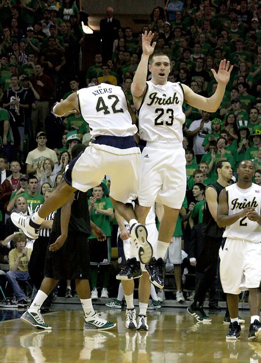 Kyle McAlarney and Ryan Ayers celebrate the defensive effort against USF.