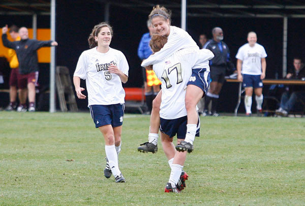 Irish Blast Past Central Michigan, 6-1 Rose Augustin jumps into the arms of Courtney Barg, as Molly Campbell joins the celebration after Augustin's second-half goal in a 6-1 NCAA Championship second-round win over Central Michigan on Sunday afternoon at Alumni Stadium.