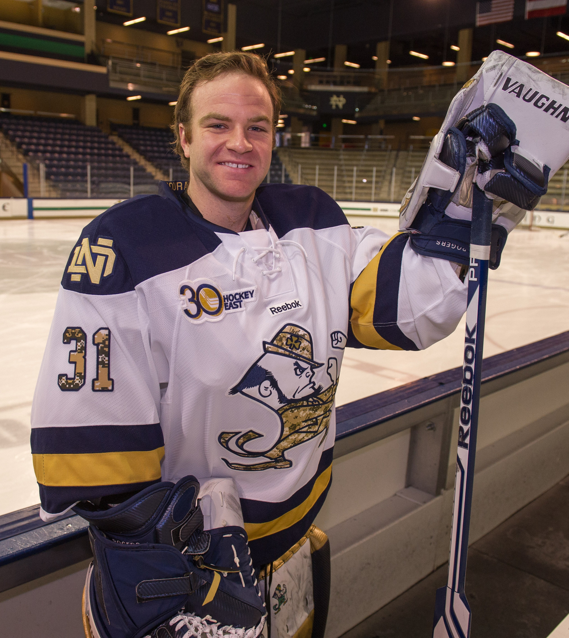 Irish Hockey To Hold On Line Jersey Auction From Jan. 24 – Feb. 4 Senior goaltender Joe Rogers models the jersey that Notre Dame will wear versus Northeastern this weekend to raise money for Hockey Saves.