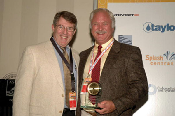 George Block (’73) Honored By USOC With Rings Of Gold Award George Block (right) with current Notre Dame head coach Tim Welsh after receiving the ASCA Ousley Award in 2006 (ASCA)