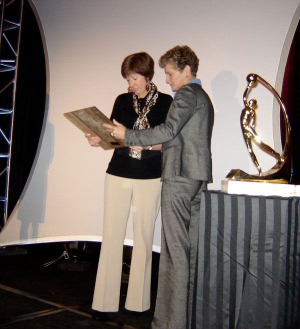 Notre Dame head coach Muffet McGraw is presented with the 2009 WBCA Carol Eckman Award from WBCA CEO Beth Bass during the WBCA Awards Luncheon on Tuesday at the Hyatt Regency Riverfront in St. Louis.