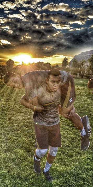 Hazem Khazbak carries teammate Jonah Shainberg during training with "The Program," which uses military boot camp techniques to help develop teams. Khazbak and Shainberg have developed a close friendship since arriving on campus, tied together by faith in each other, their team and Notre Dame.