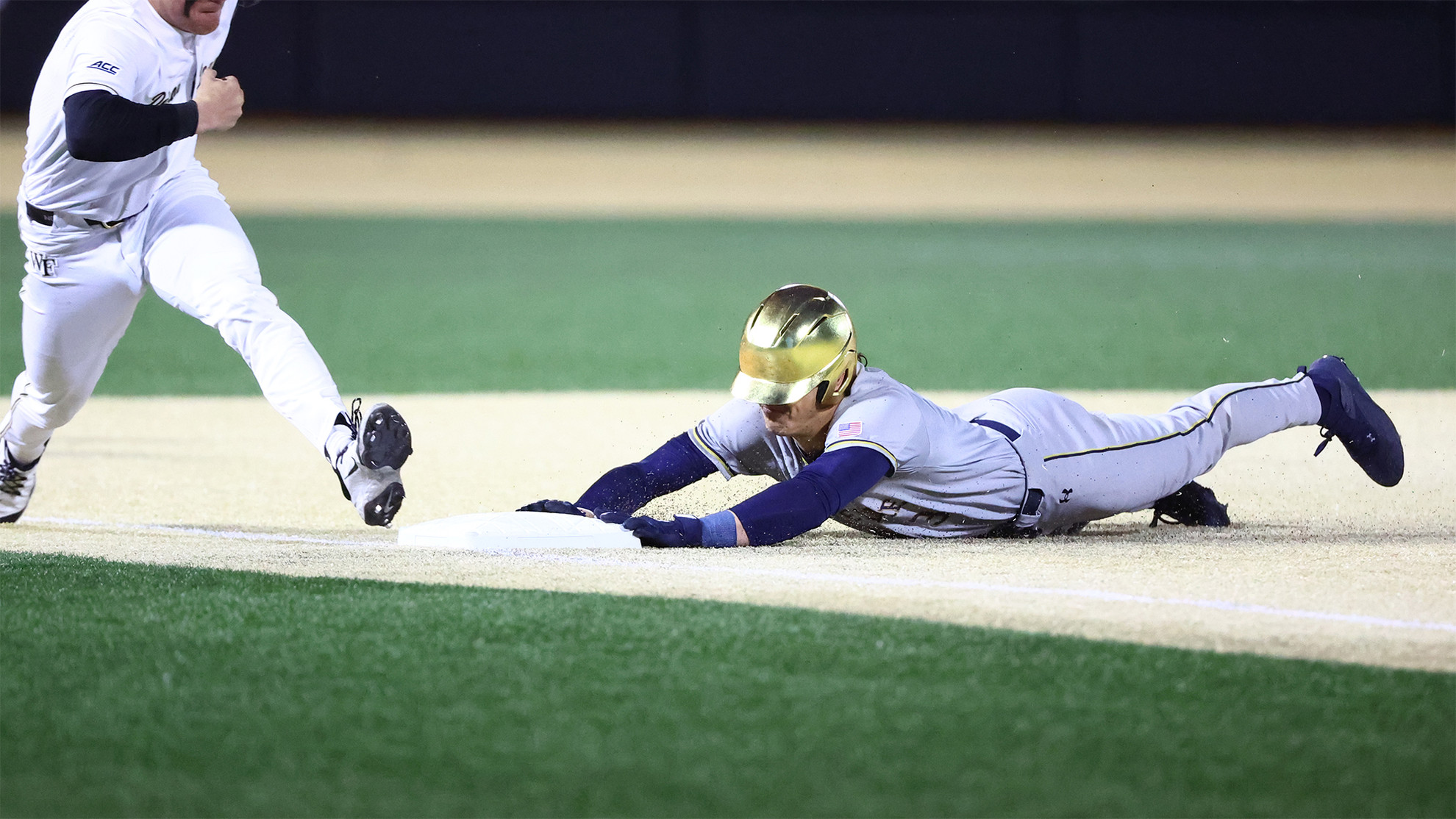 Irish Comeback Stopped Short Estevan Moreno slides into third base safely.