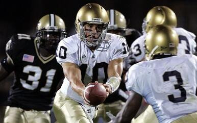No. 13 Notre Dame Flies Past No. 22 Purdue, 49-28 Brady Quinn hands off to running back Darius Walker during the first quarter against Purdue on Saturday night.
