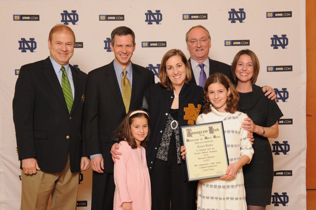 Tricia Bellia (center) with her husband, A.J. (left), daughters, Kate and Molly, and Notre Dame athletics director Jack Swarbrick (photo by Mike Bennett)