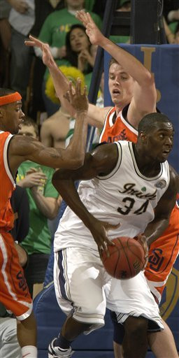 Irish Fall To No. 7 Syracuse, 70-61 Torin Francis attempts to drive around Syracuse center Craig Forth during first half.