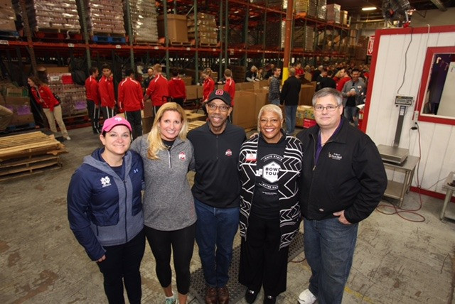 Kellys and Meyers Come Together Before Game to Help Needy Paqui Kelly and Shelley Myers have different rooting interests on Friday, but had the same good deeds in mind on Thursday.
