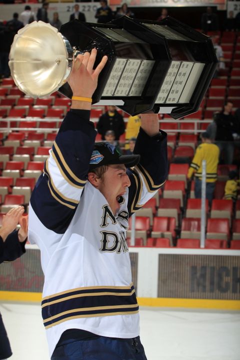 Anders Lee carries the Mason Cup following the Irish win over Michigan.  The junior center was named a second team CCM Hockey All-American on Friday at the Frozen Four.