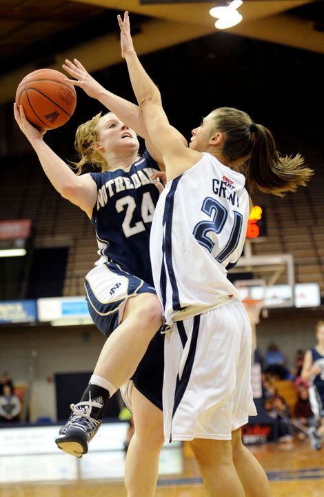 Lindsay Schrader drives against Villavona's Tia Grant during the first half.
