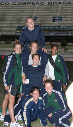 Letters From Brazil #3 – Junior Jamboree Notre Dame's prospective seniors for the 2005 season, shown here on the field of Guarani Stadium, include: (kneeling, from left) Maggie Manning and Miranda Ford; (standing, across middle) Annie Schefter, Katie Thorlakson and potential fifth-year player Candace Chapman; and Jenny Walz on Erika Bohn's shoulders.