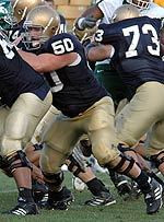 Paving The Way Dan Santucci (50) along with teammates Ryan Harris (68) and Mark LeVoir (73) perform as precision unit to hold off the Michigan State pass rush in the September 11 game at Notre Dame Stadium.