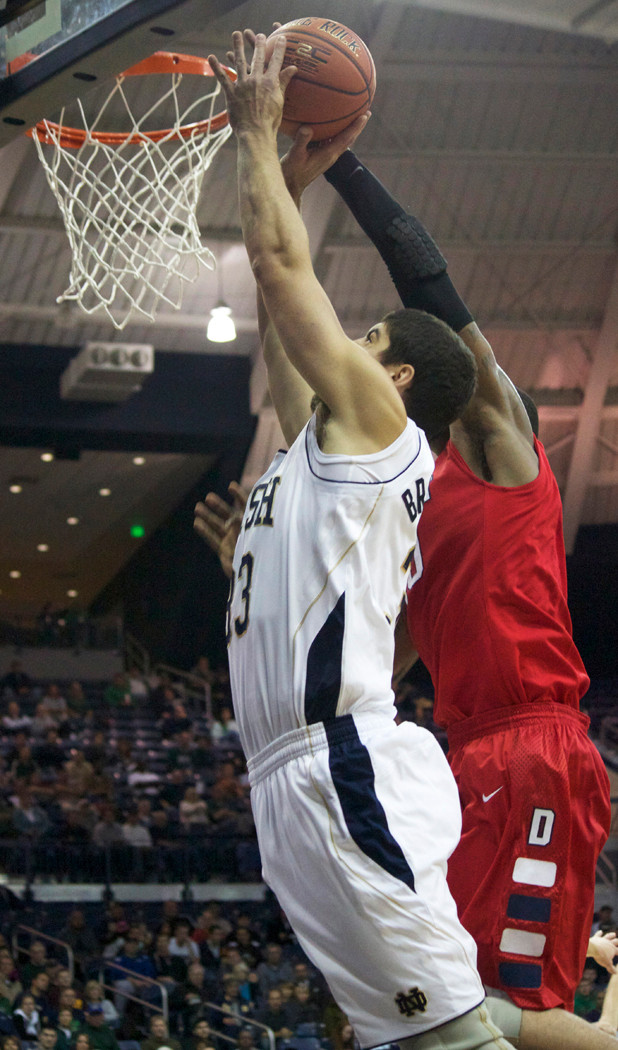Irish Fly Past Sam Houston St., 74-41 Mike Broghammer goes up for a dunk.