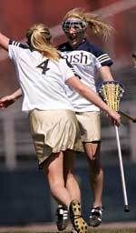 Caitlin McKinney and Lindsay Shaffer (#4) celebrate McKinney's second goal of the game in Notre Dame's 12-9 win over Rutgers.