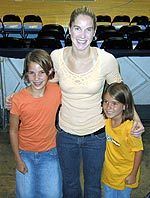 Former Irish all-star Megan Duffy poses with some WNBA players after a recent contest.