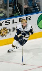 Defenseman Kyle Lawson and the Notre Dame Fighting Irish face off versus Massachusetts in the opening game of the Lightning College Hockey Classic on Dec. 29