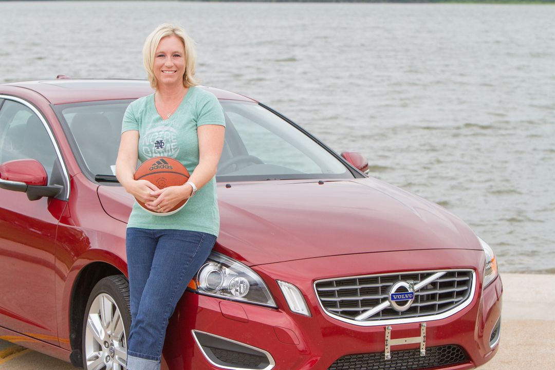 Lisa Kelly poses with her brand new Volvo - the top prize in the Biggest Fan of the BIG EAST search