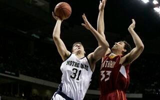 Rob Kurz shoots against Winthrop forward Phillip Williams during the first half.