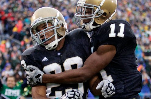 Golden Tate, left, and Shaquelle Evans celebrate Tate's 67-yard touchdown.