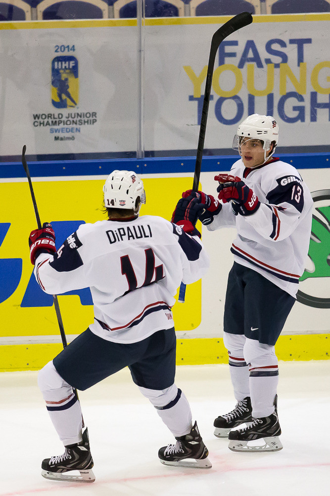Vince Hinostroza’s Four-Point Game Leads USA To An 8-0 Win Over Germany At 2014 IIHF World Junior Championships Thomas DiPauli celebrates a Team USA goal with Vince Hinostroza.