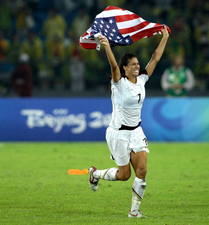 Shannon Boxx celebrates with the American flag after the United States beat Brazil in the women's soccer gold medal match. (AP Photo/Petr David Josek)