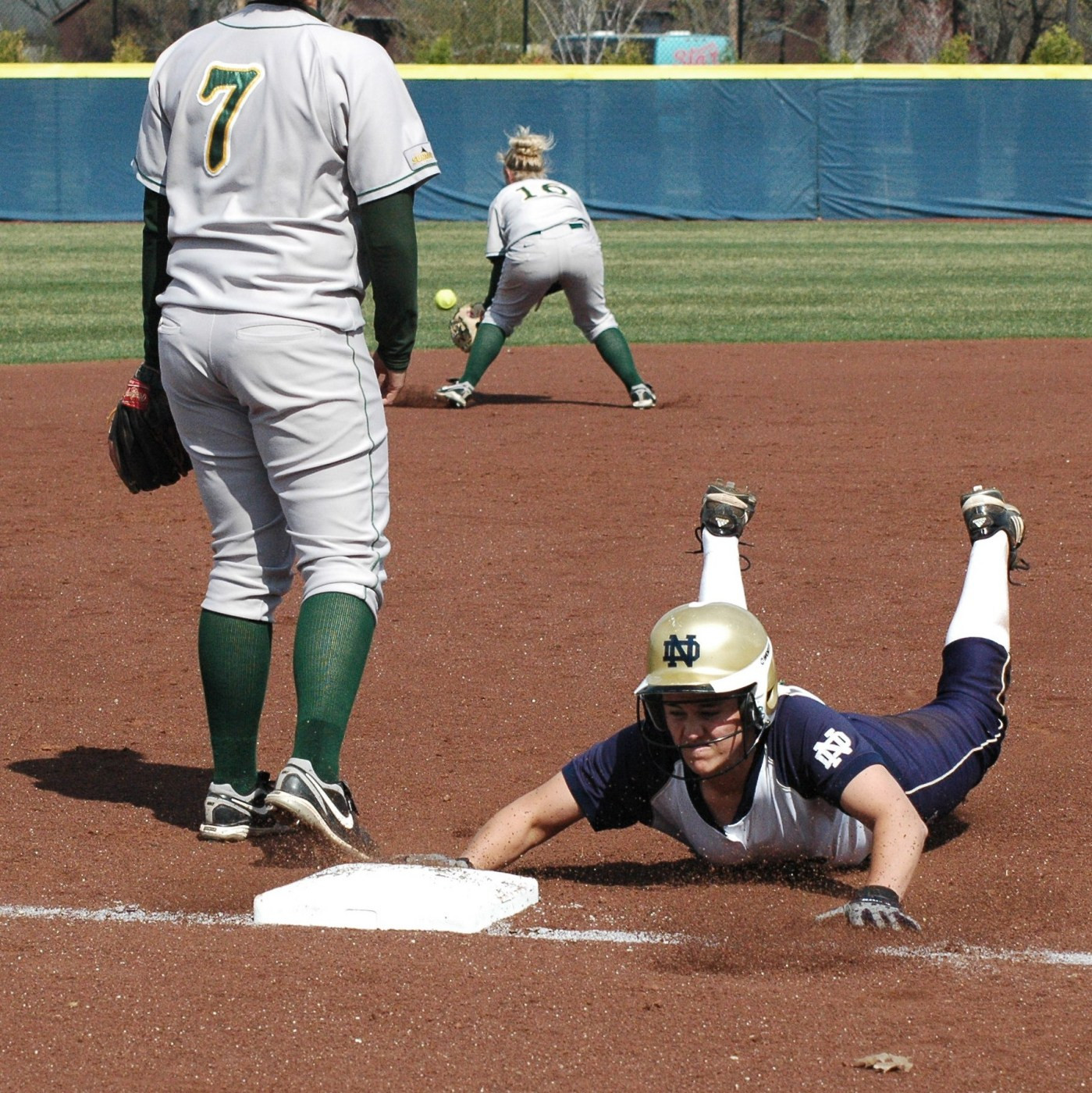 Irish Charge Past Bison In Game Two For Doubleheader Split Beth Northway slides into third. She finished the day with four hits in four at-bats.