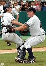 Notre Dame catcher Paul O'Toole, left, and relief pitcher J. P. Gagne celebrate the final out of their 3-1 win over Florida State in the NCAA Super Regional, Monday, June 10, 2002, in Tallahassee, Fla. With the win, Notre Dame advanced to the College World Series for the first time in 45 years. (AP Photo/Phil Coale)