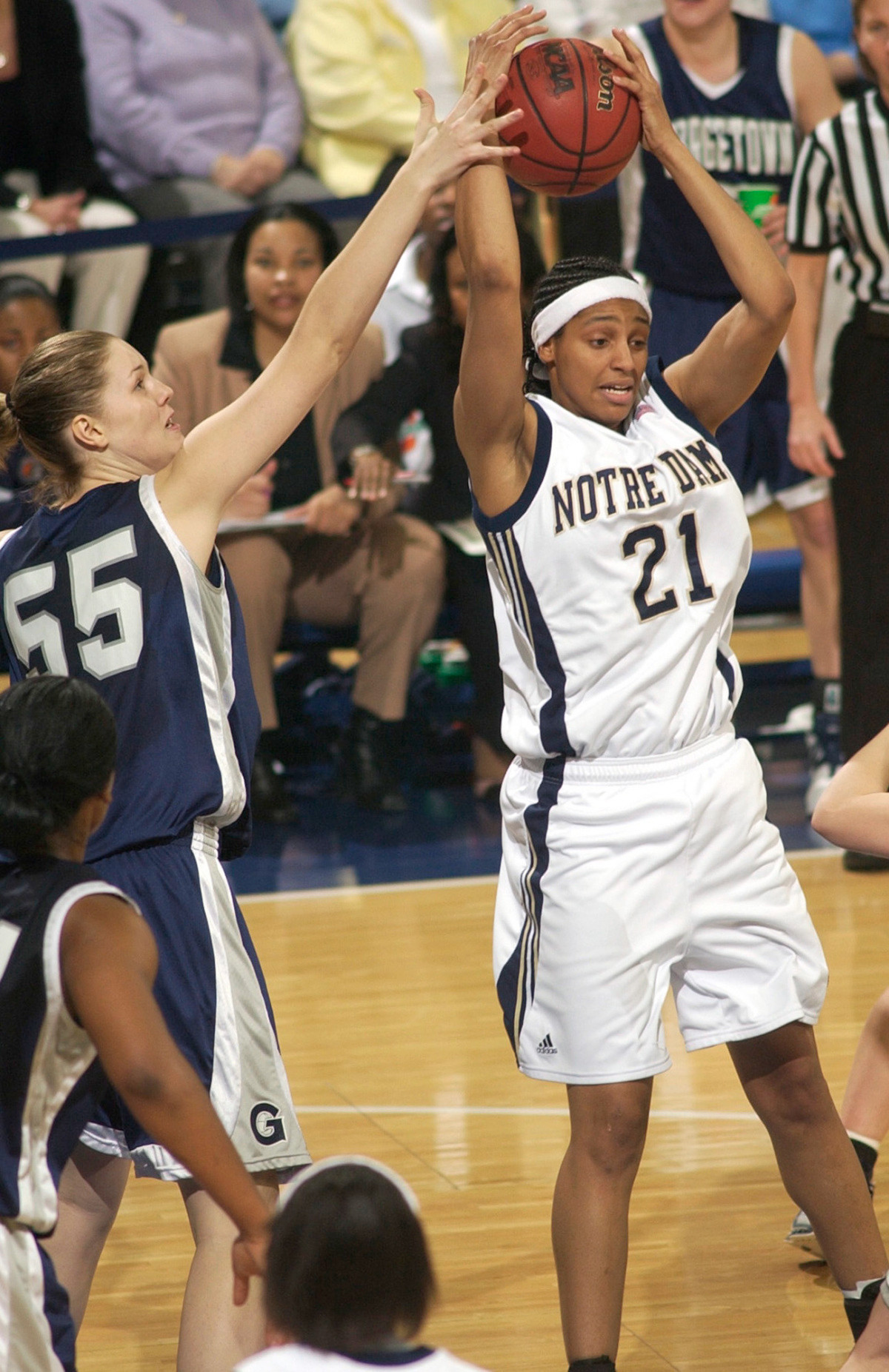 Fighting Irish Defeat Georgetown, 72-58 Jacqueline Batteast grabs a pass around Georgetown center Christine Whitt.