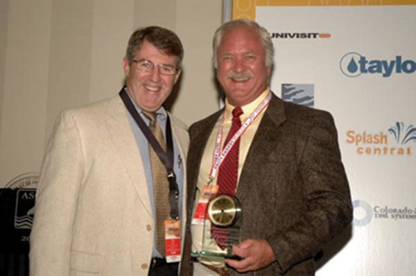 George Block (right) with current Notre Dame head coach Tim Welsh after receiving the ASCA Ousley Award in 2006 (ASCA)