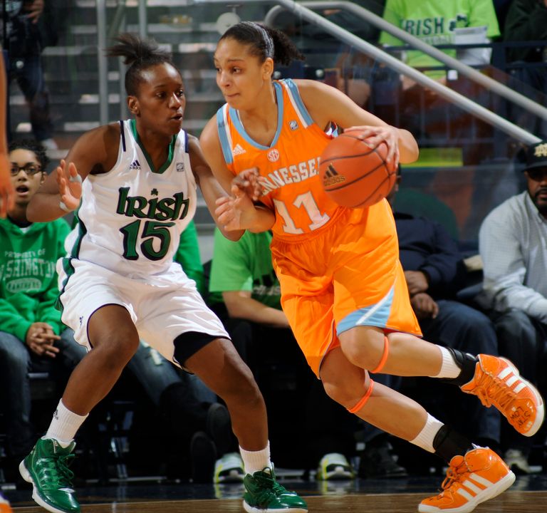 Tennessee guard Cierra Burdick, right, drives the lane as Notre Dame guard Kaila Turner defends.