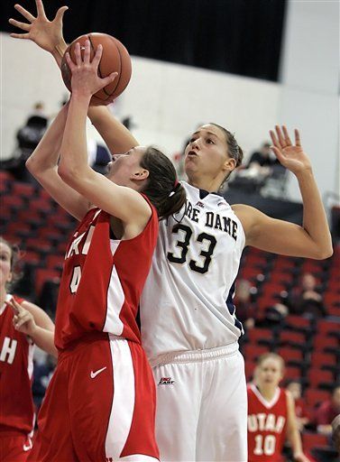 Tournament MVP Melissa D'Amico, right, blocks a shot by Utah's Kim Smith. (AP Photo/Jae C. Hong)
