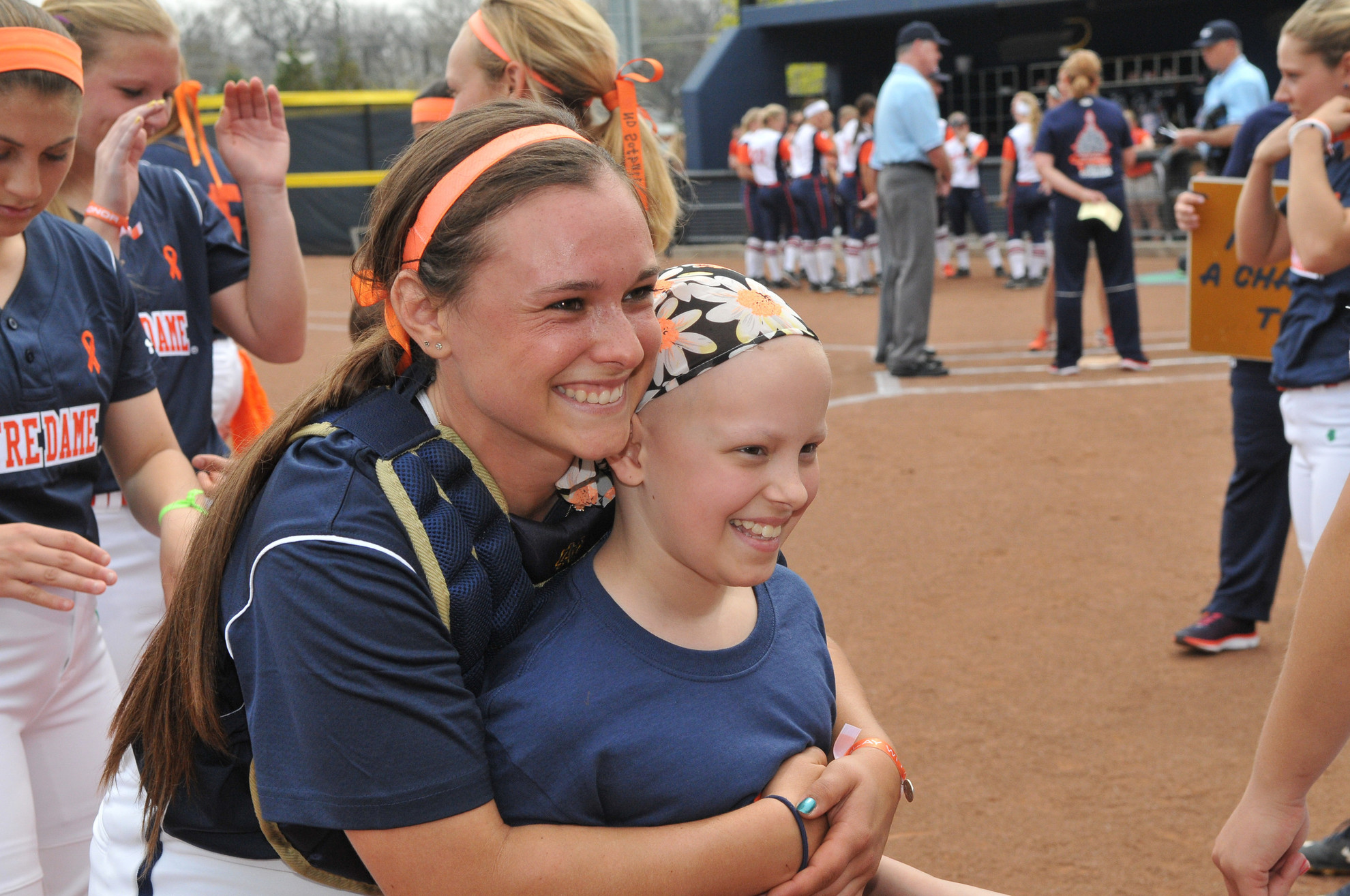 Diamond Details: Louisville (Strikeout Cancer) Senior catcher Casey Africano and softball Fighting Irish Fight for Life teammate Hannah at the 2015 Strikeout Cancer series