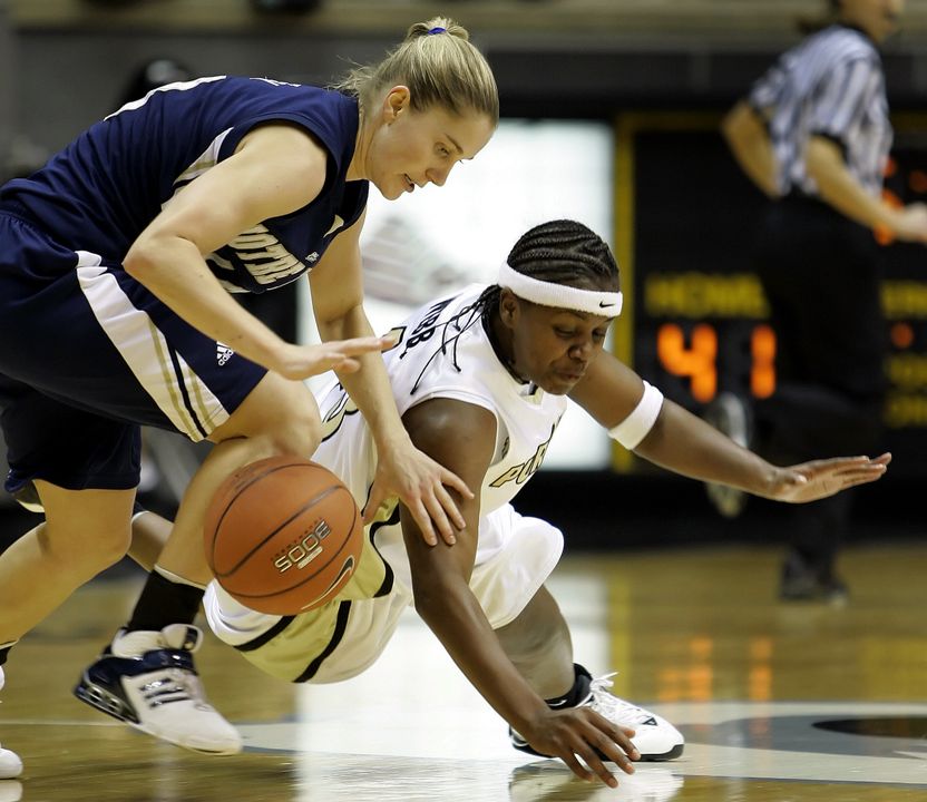 Purdue's Sharika Webb, right, and Megan Duffy scramble for a loose ball during the second half. (AP Photo/Michael Conroy)
