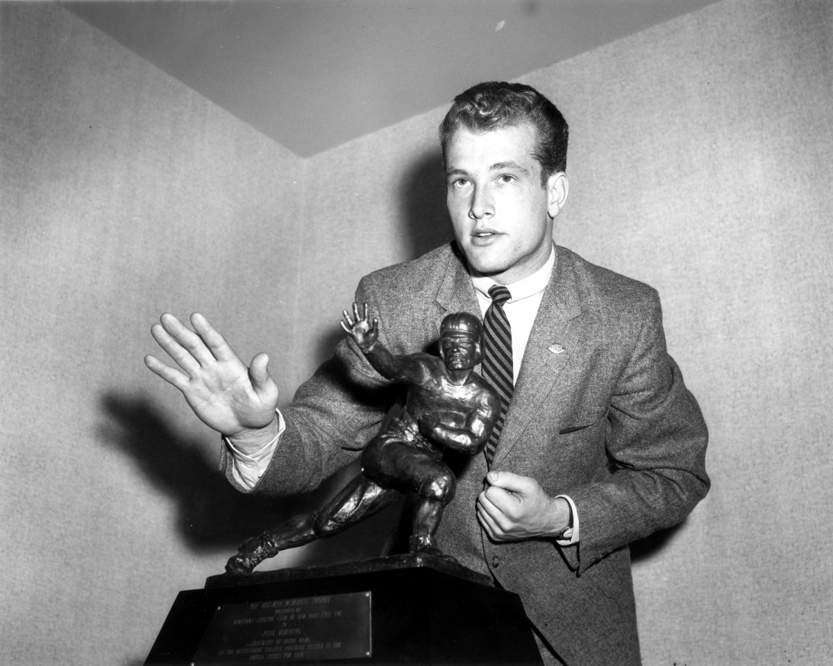 Golden Anniversary For The Golden Boy Paul Hornung poses with the 1956 Heisman Trophy as he became Notre Dame's fourth Heisman winner.