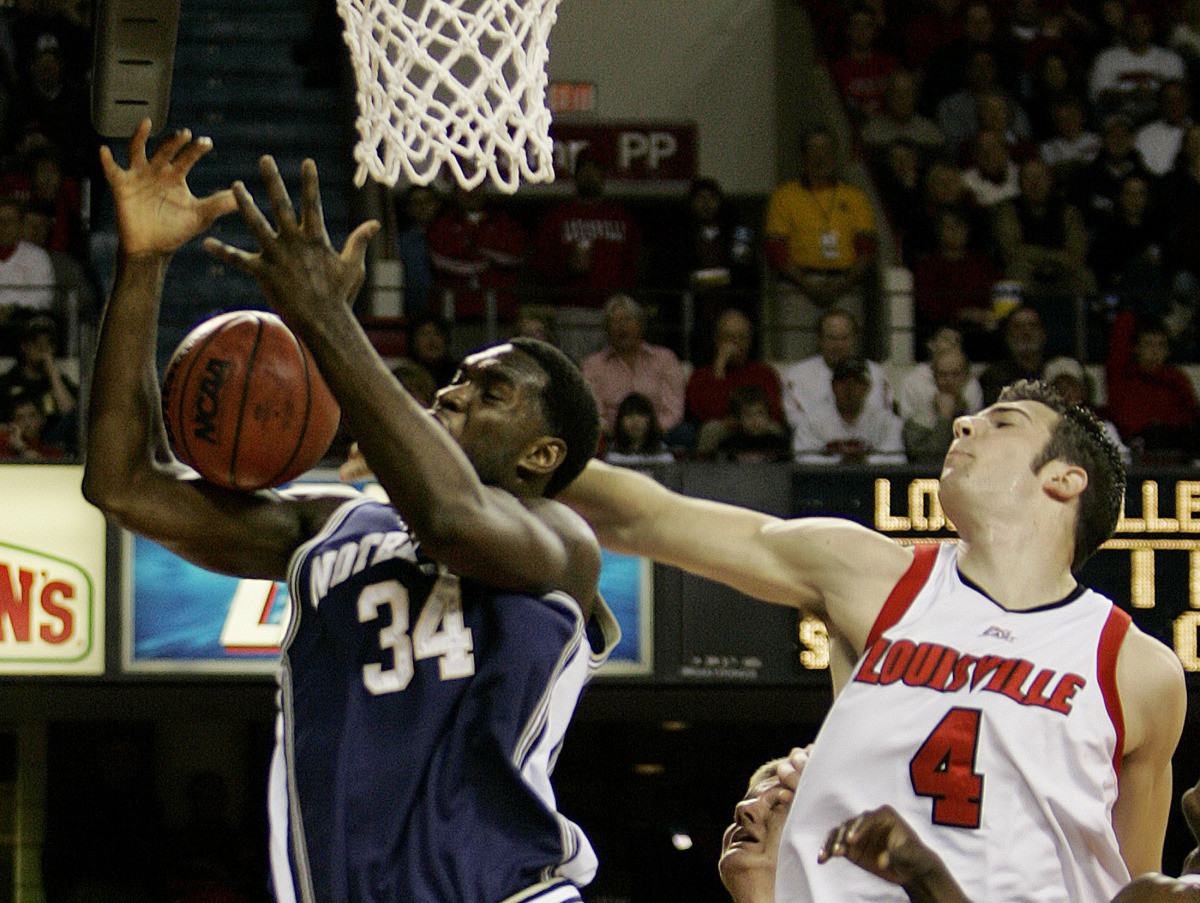 Notre Dame Falls In Overtime To Louisville, 89-86 Notre Dame's Torin Francis has his shot attempt blocked by Louisville's David Padgett during the first half of their basketball game, Saturday, Feb. 4, 2006, in Louisville, Ky. (AP Photo/Ed Reinke)