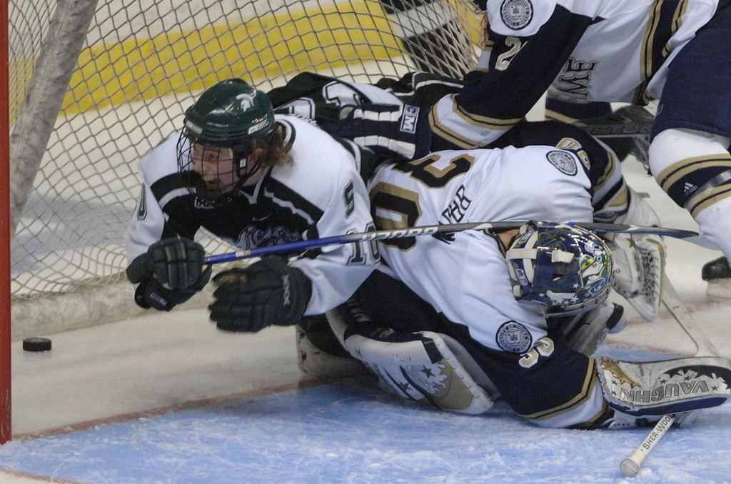 NCAA Quarterfinals - Notre Dame vs. Michigan State (AP photos)