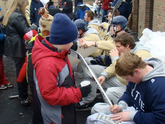 Notre Dame hockey players drink hot chocolate and sign autographs at Merrifield Park during the 2009 "Practice on the Pond."