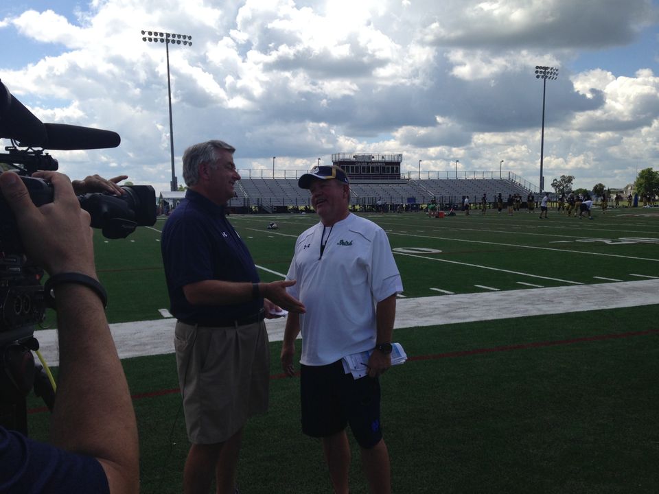 Jack Nolan and Brian Kelly share a laugh before their post-practice interview.