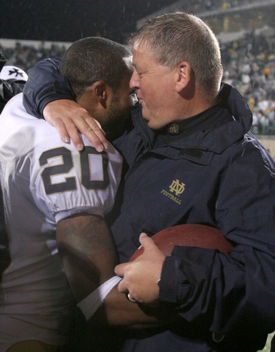 Irish head coach Charlie Weis hugs Terrail Lambert after the game on Saturday. Lambert intercepted two passes in the fourth quarter of Notre Dame's 40-37 victory over Michigan State.